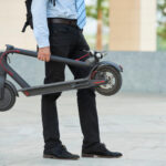 man with electric scooter micromobility