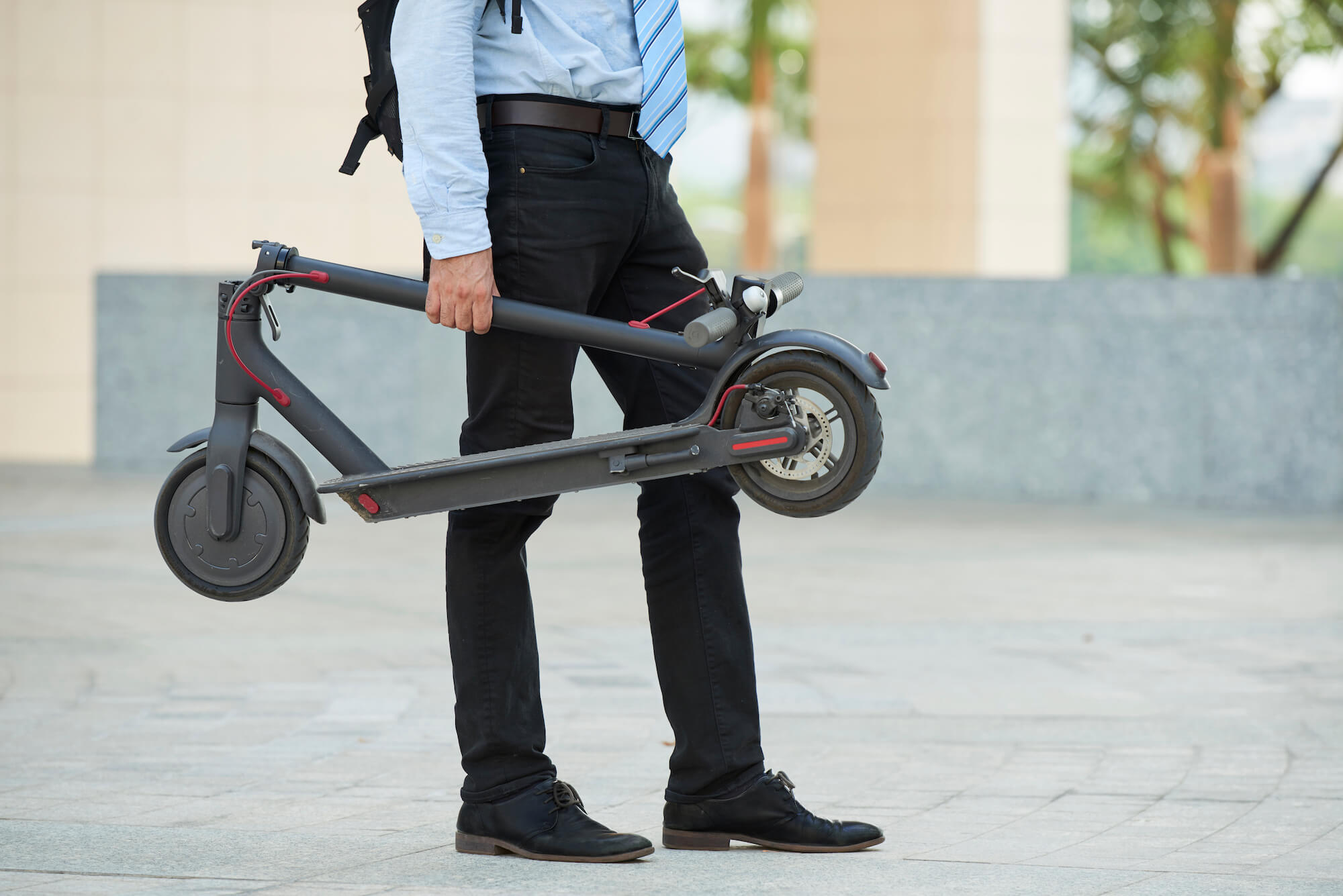 man with electric scooter micromobility